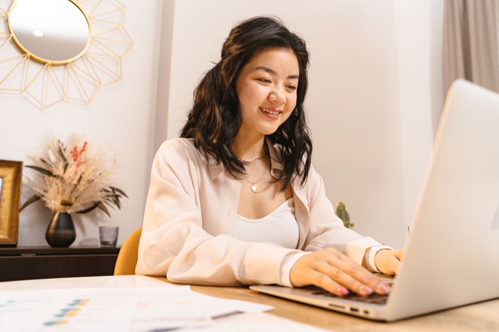 A busy professional checking their health on a laptop